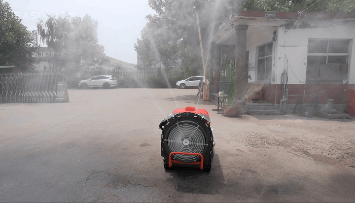 Nozzles arranged around the fan work with its airflow, carrying spray outward in multiple directions from the spraying assembly.