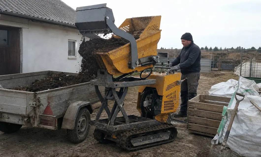 Farm trailer loading for raised compost transfer across working fields