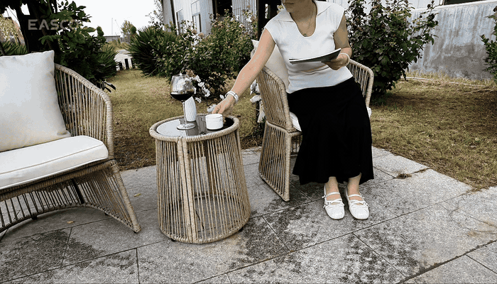 Coordinated Set Design: Two rope-woven chairs and a drum table form a compact group.