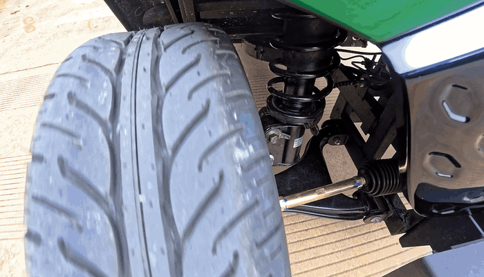 Visible suspension movement follows the wheel while driving.