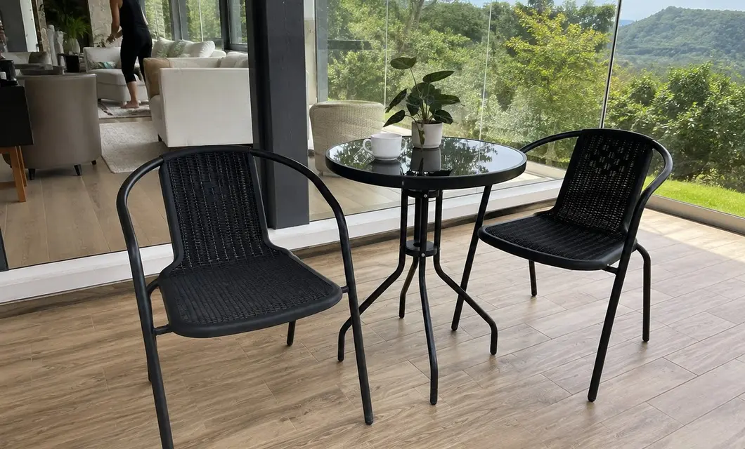 Open seating beside water for relaxed outdoor dining, conversation, and rest.