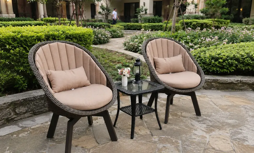 Courtyard lounge seating with woven shells and soft cushions.