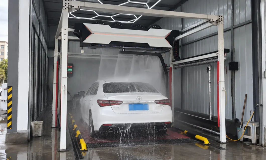 Rocker-arm spray covers roof and rear body areas during the automated wash cycle.