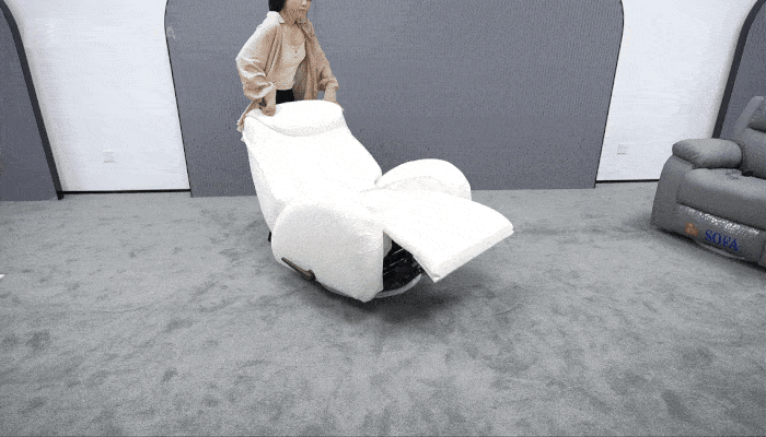 The chair remains stable while reclining and returning upright, with the base staying firmly supported on the floor.