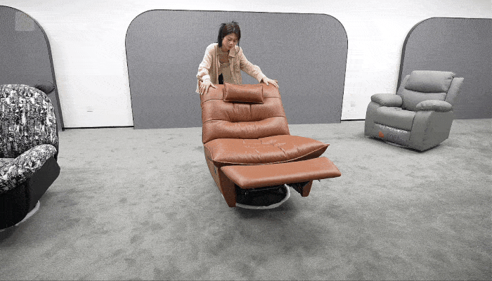 The chair remains stable while reclining and returning upright, with the base staying firmly supported on the floor.