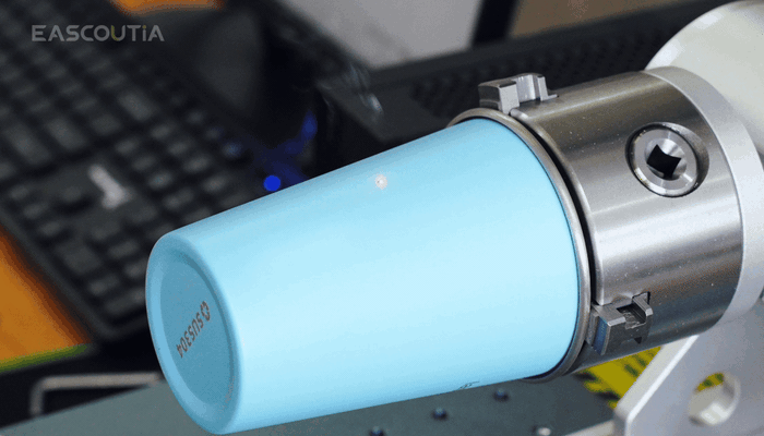 Full-wrap marking on tumblers and mugs in one rotary setup.