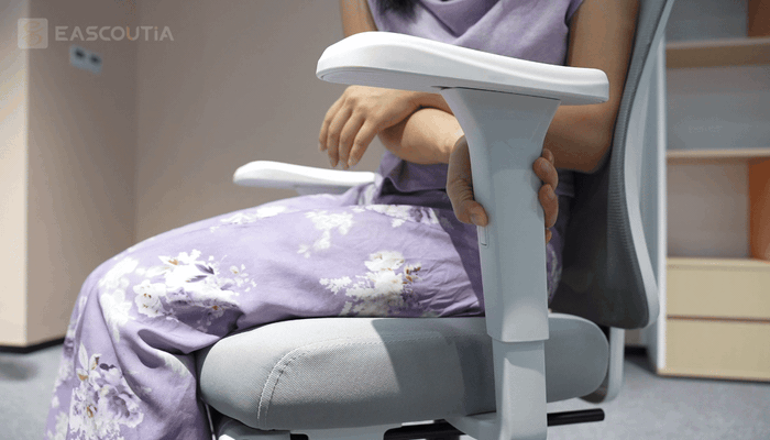 The armrest moves up and down along its post, allowing its support height to be adjusted to how you rest your arms.
